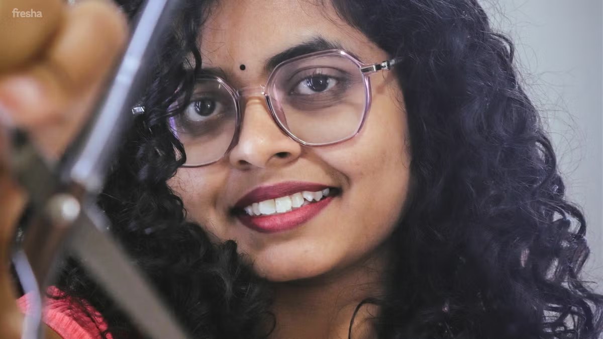 Stylist with curly hair at Curl Fixers